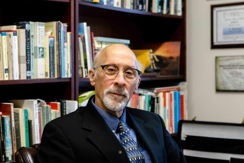Lewis Delves into the Dark Humor of Boston Literature