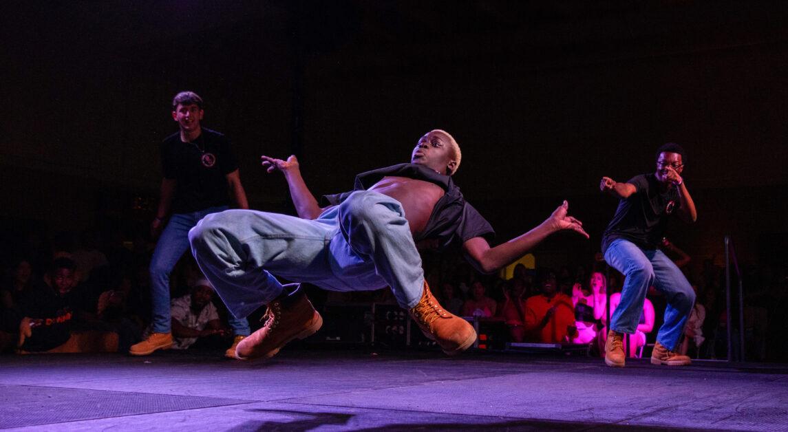 A new member of Sexual Chocolate, Boston College’s all-male step team, dances at Rookie Showcase on Friday, October 27, 2023 (Kellen Davis / Heights Staff).