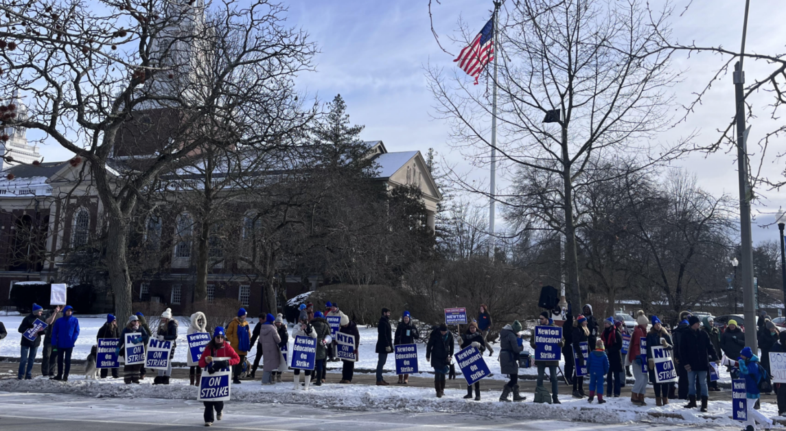 Despite the cold, teachers and community members rallied in front of City Hall Saturday afternoon. (Will Martino / Heights Editor)