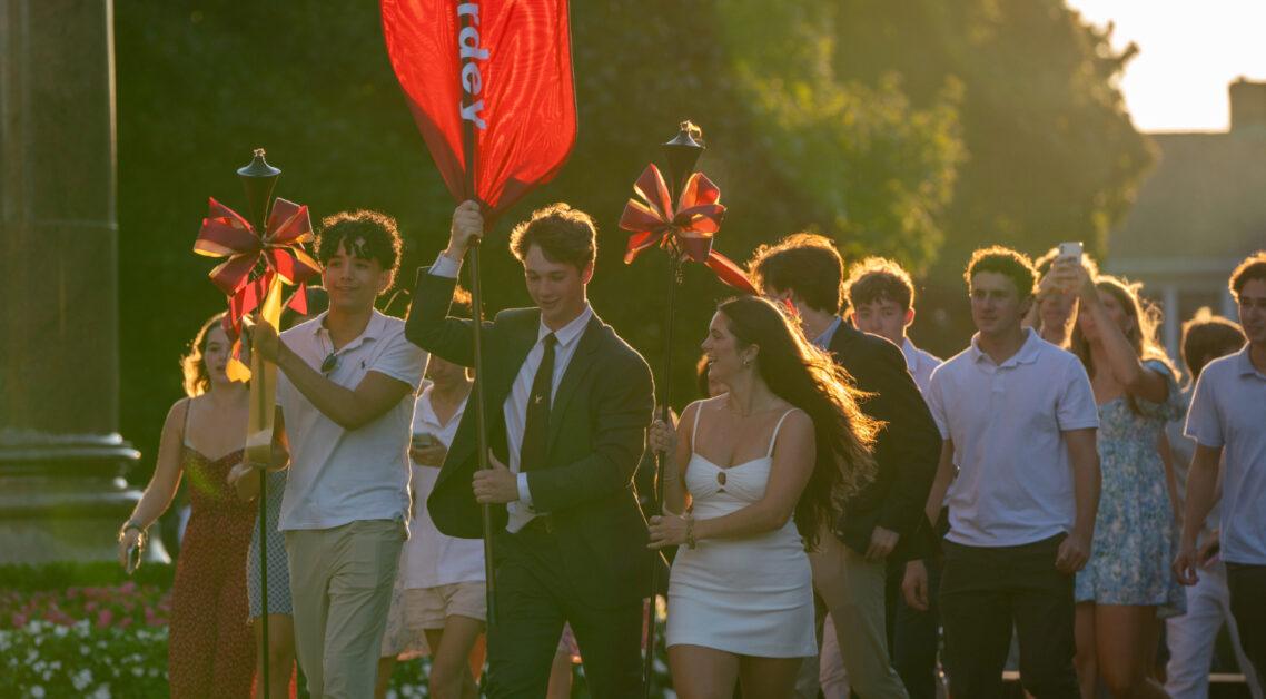 The class of 2028 and the inaugural Messina College class marched down Linden Lane Thursday evening, banners held high, celebrating the inception of their time at Boston College.