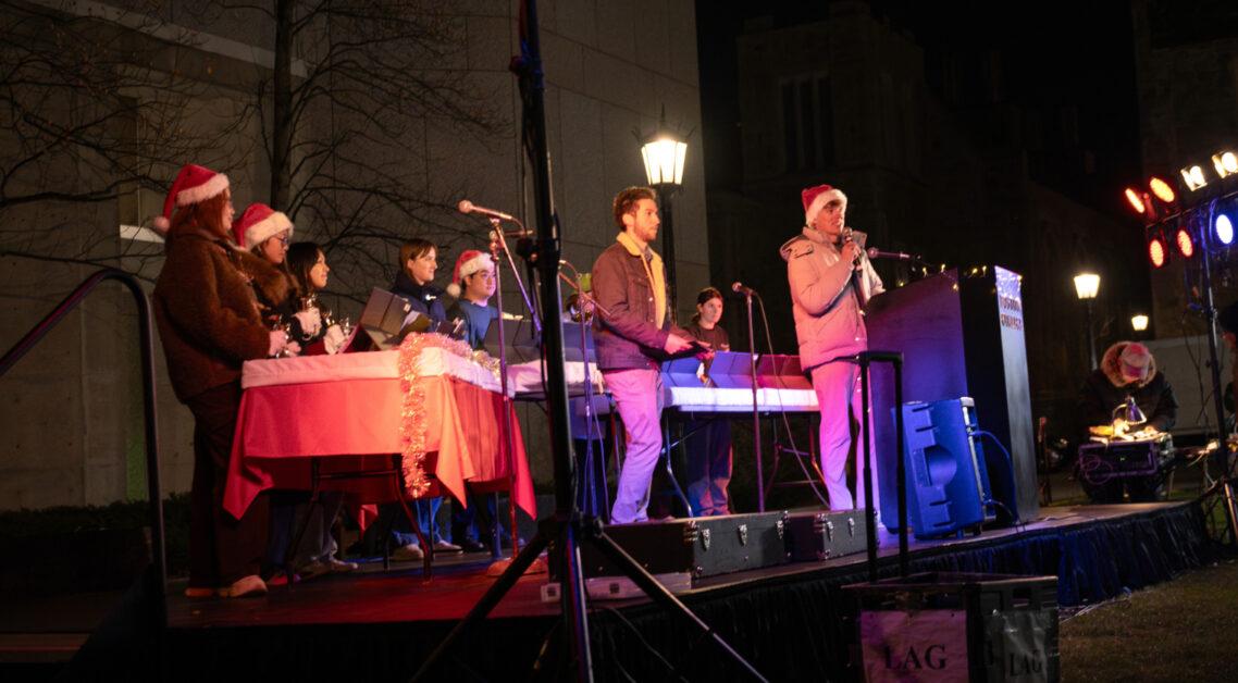 With Gasson Hall glowing in green and red, Christmas carols filling O'Neill Plaza, and students braving the cold with hot cocoa in hand, the Boston College community kicked off the holiday season at the annual Christmas tree lighting ceremony.