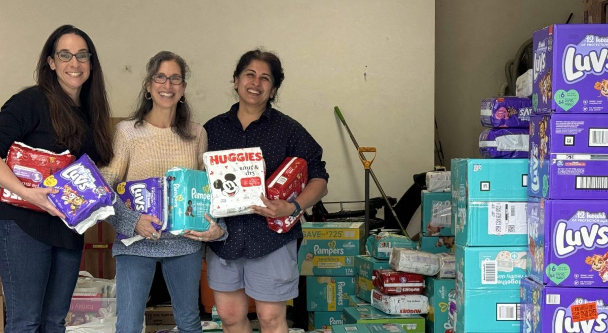 (Left to right: Jenny Klein-Sosa, Lisa Goldstein Gordon and Shalini Tendulkar organize donations to their organization's diaper drive / Courtesy photo)