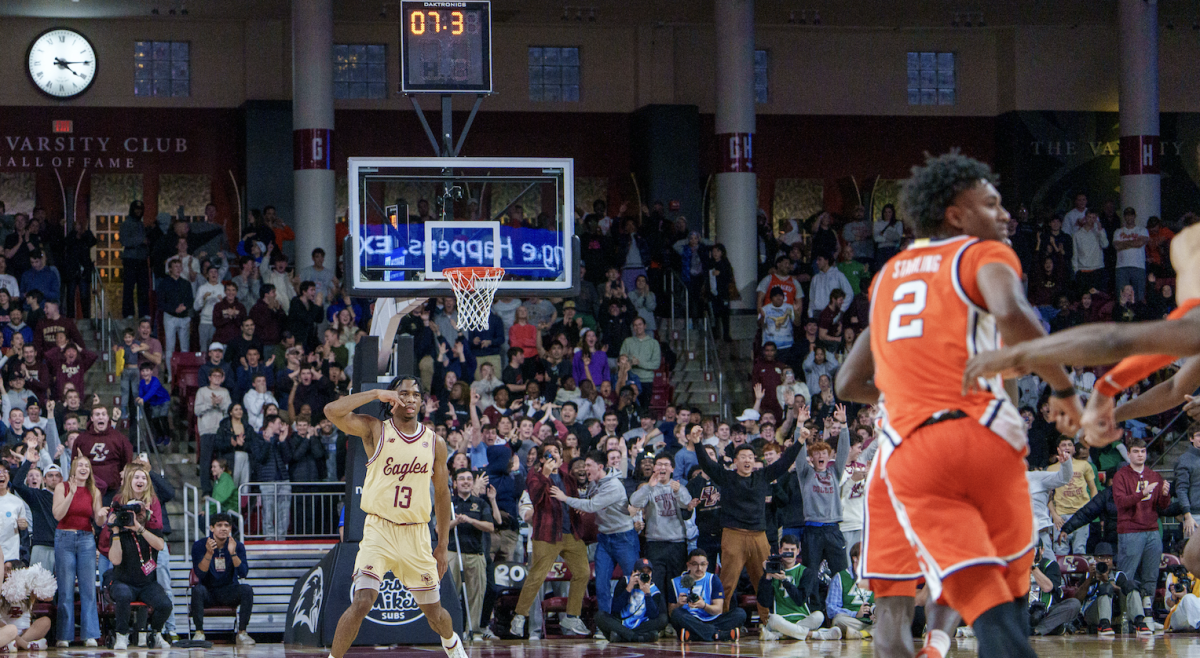 Hand, pictured, celebrates after sinking a game-tying three at the end of regulation. (Anatoly Guz / Heights Staff)