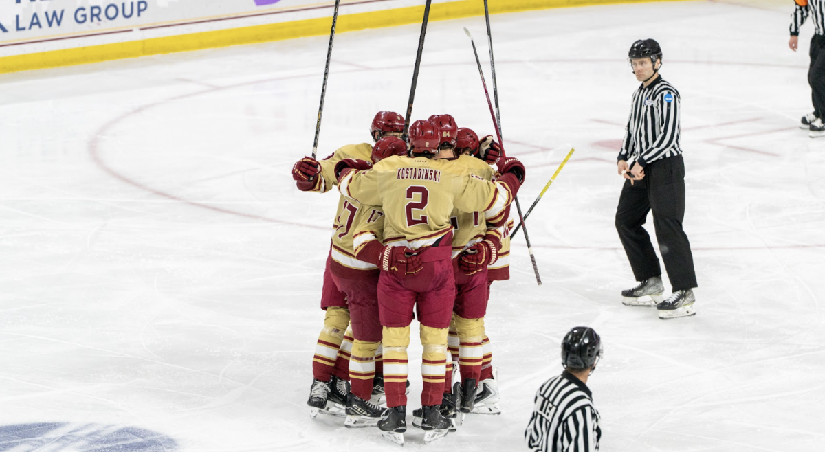 The Eagles celebrate during their 5–2 win over New Hampshire that put them back in the win column. (Anatoly Guz / Heights Staff)